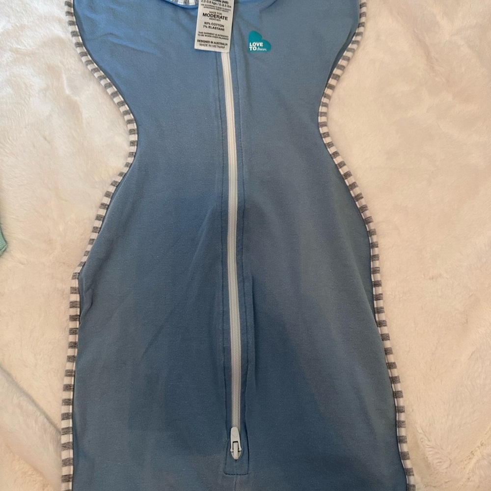 Love to Dream Blue Infant Swaddle with Stripe Trim. Newborn